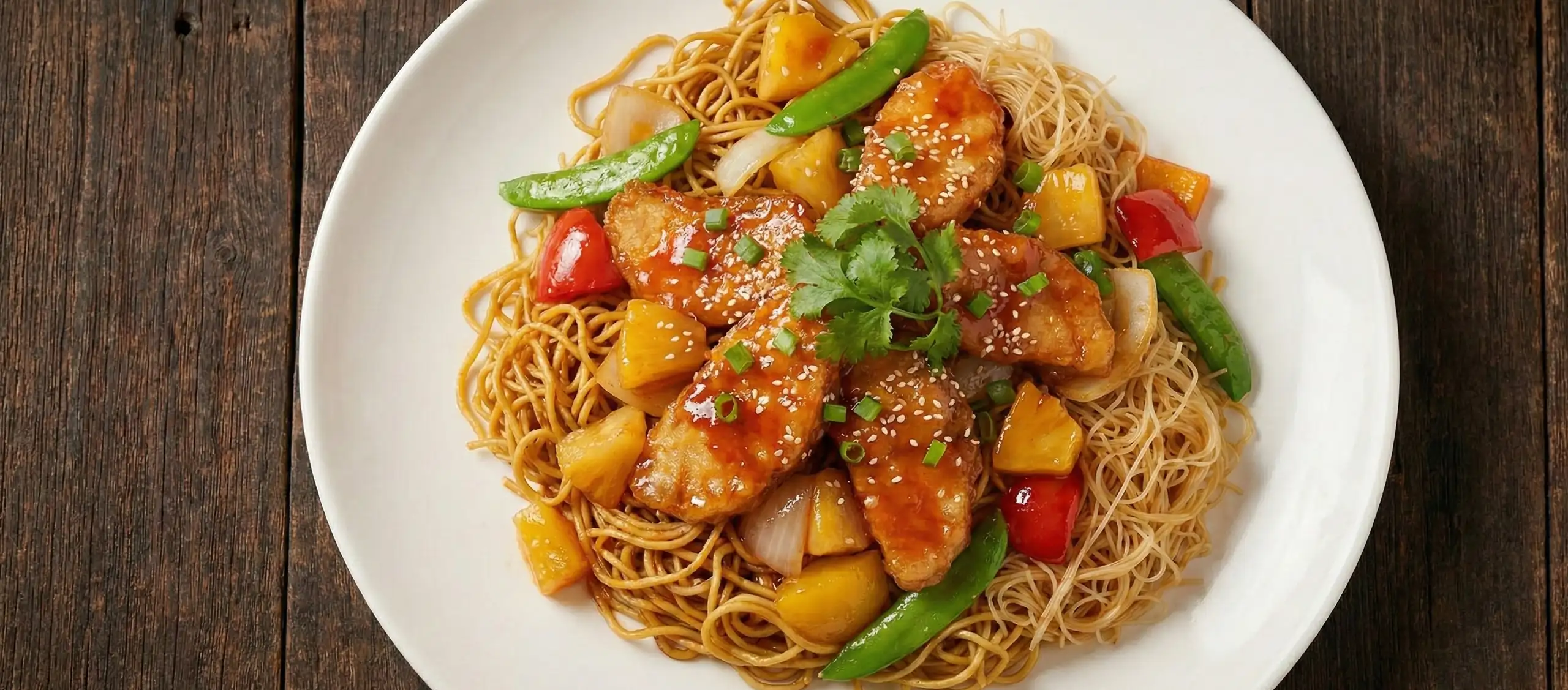 Sweet and Sour Chicken with Pineapple on Crispy Noodles